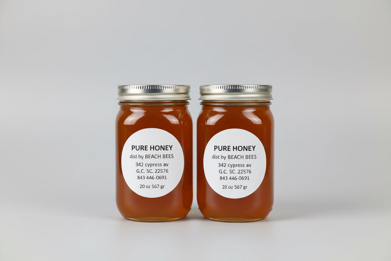 Two jars of pure honey with labels