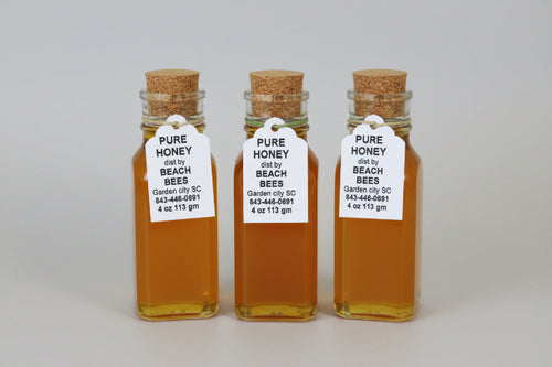 4 4 ounce jars of pure honey with labels 
